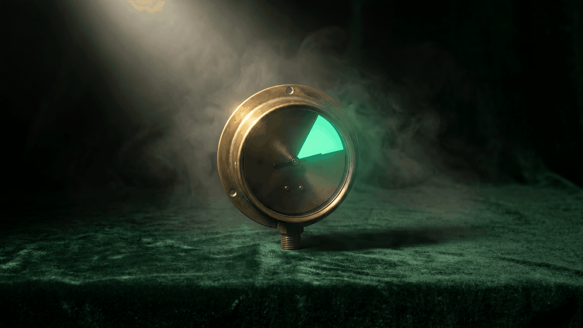 Vintage brass pressure gauge with its dial glowing mint-green against dark green velvet and atmospheric fog — a metaphor for dialing in HEDIS quality performance at community health centers without adding staff